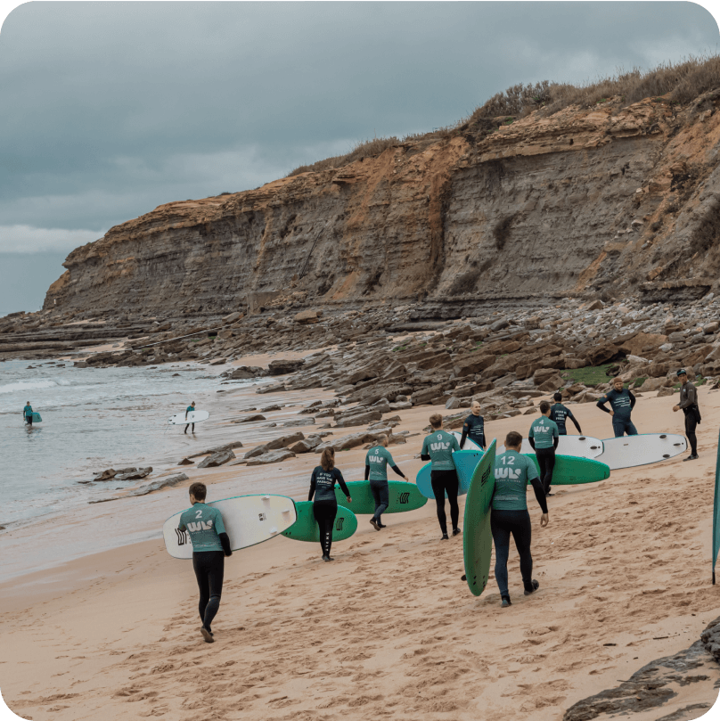 Gitpod team members with surfing boards.